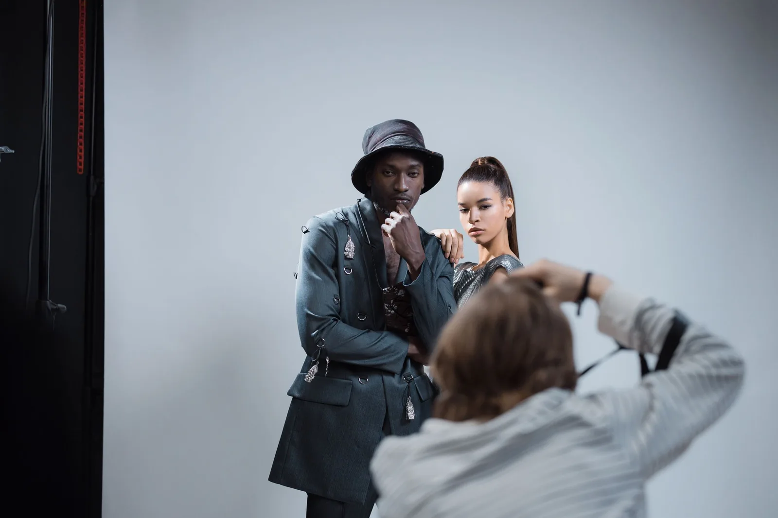 Photographer shooting two models in the studio
