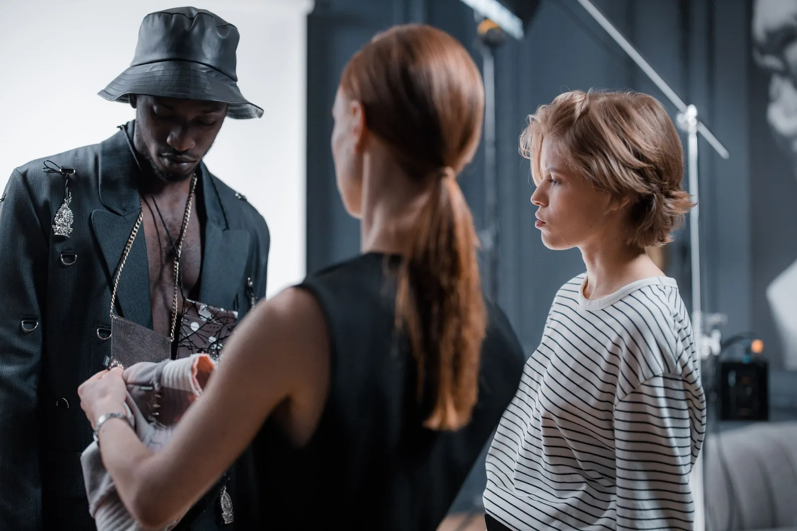 Model and team preparing a look on set