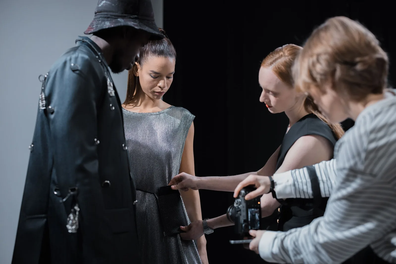 Team checking frames on the camera between looks