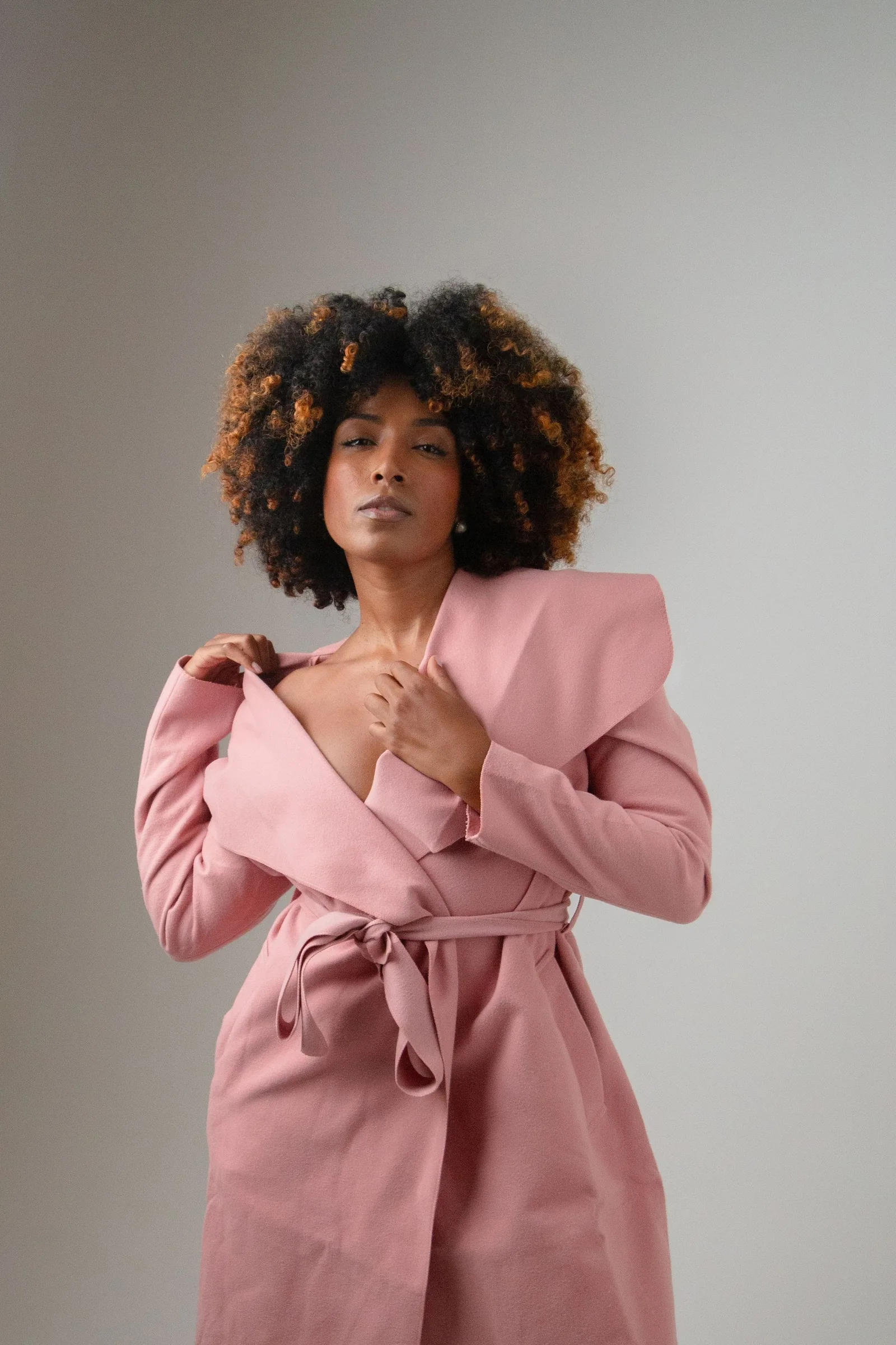 Model in a pink coat, three quarter view