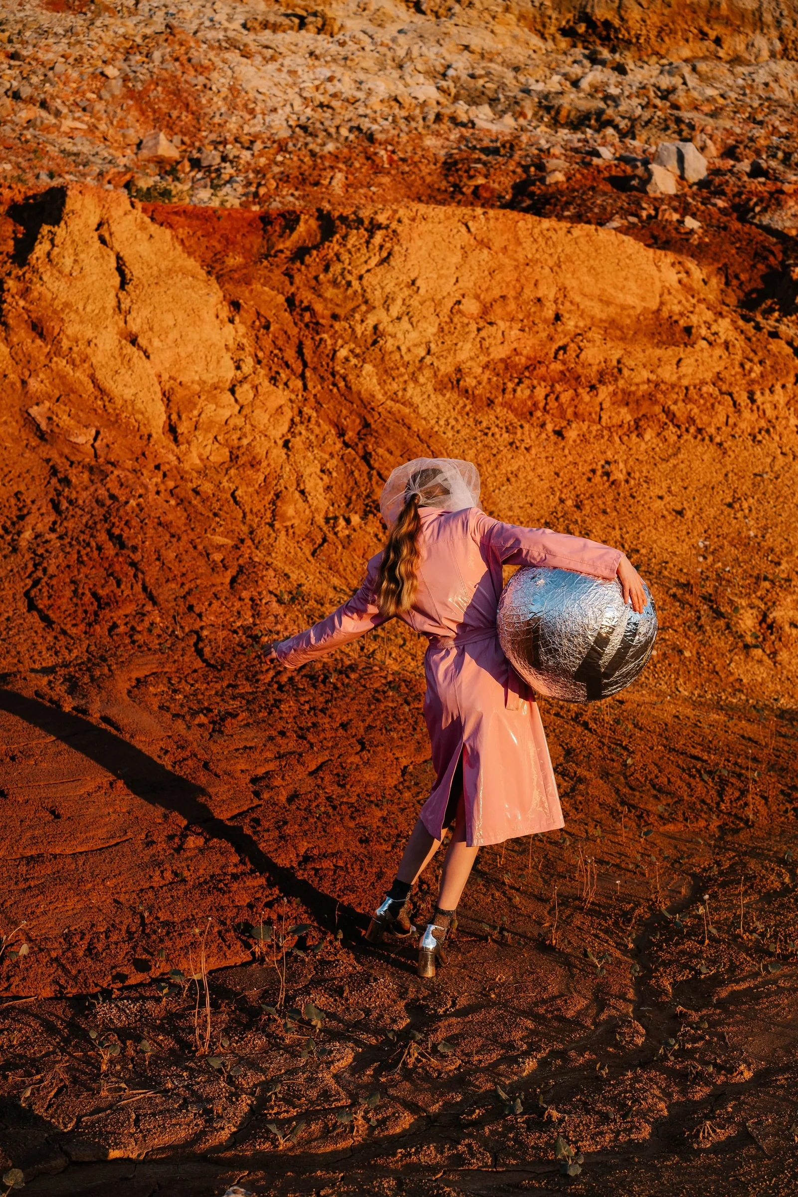 Campaign: model walking across red hills