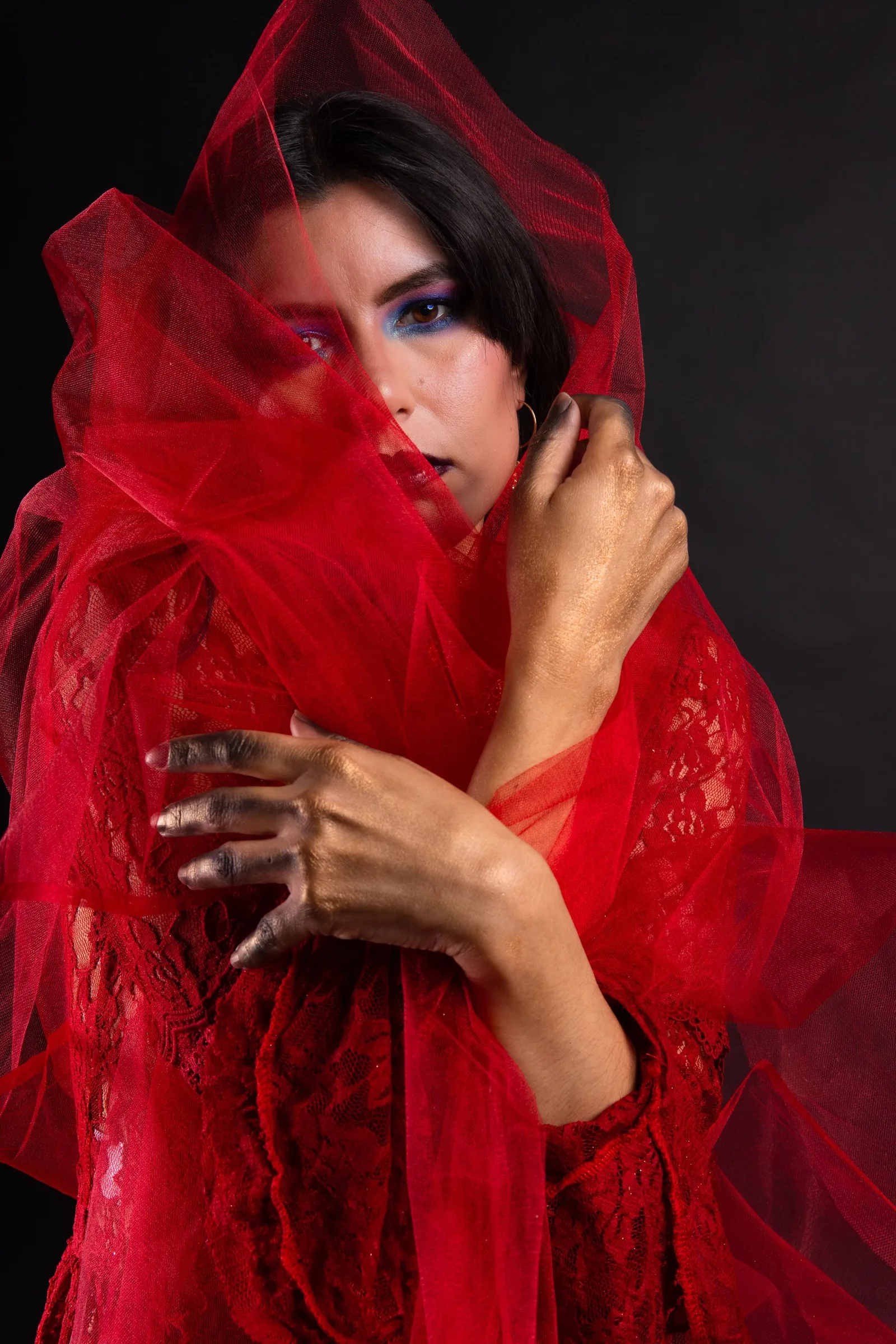 Editorial: model wrapped in red tulle
